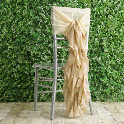 Champagne ruffled chair sash draped on a silver chiavari chair