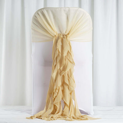 Beige chair cover with draped fabric detail on a white backdrop.