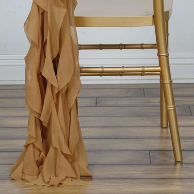 Ruffled tan fabric draped elegantly over a gold chair leg.