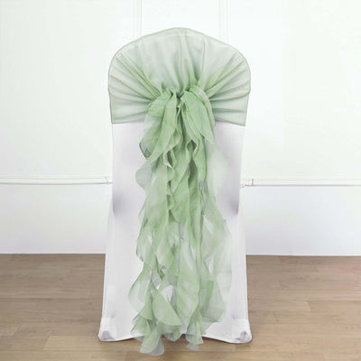 Green chiffon chair sash draped elegantly on a white chair