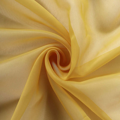 Sheer yellow fabric draped in a spiral pattern.