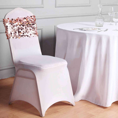 Elegant white chair with decorative sequin cover beside a dining table.