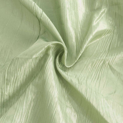 Textured light green fabric with a subtle sheen.