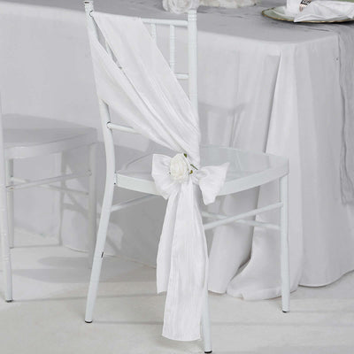 White chair with elegant draped fabric and rose decoration