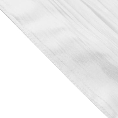 Close-up of soft, textured white fabric showing fine details.