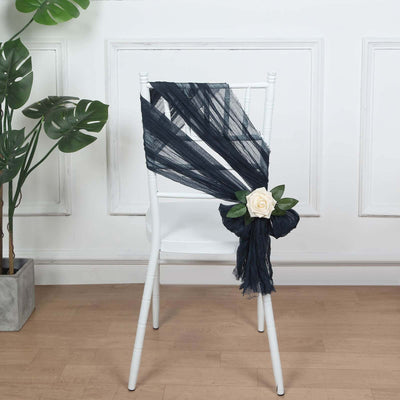 Navy blue chiffon chair sash with white rose decoration.