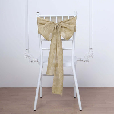 Burlap bow tied on a white chair for elegant decor