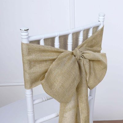 Beige burlap chair sash bow on a white chiavari chair.