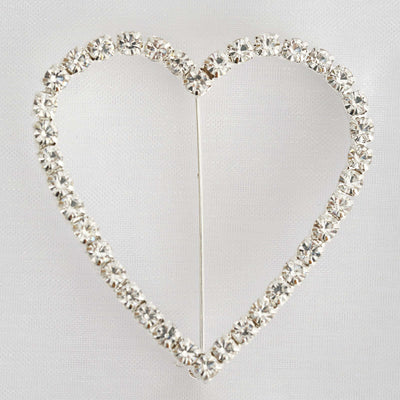 Silver heart-shaped brooch adorned with sparkling rhinestones