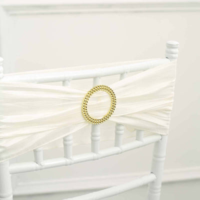 White chair sash with gold embellishment
