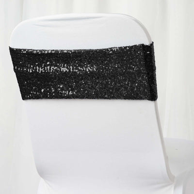 Black sequined chair cover for elegant event decor.