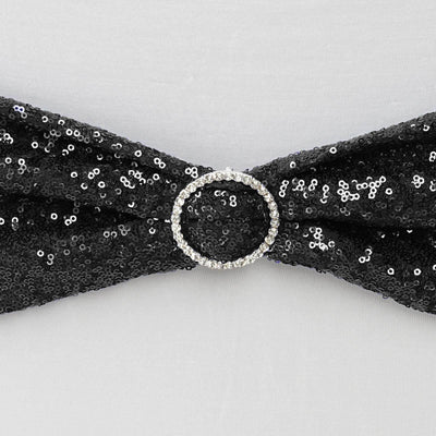 Black sequin bow with a rhinestone buckle detail