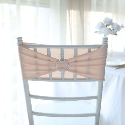 Peach chair sash with rhinestone buckle on a white chair