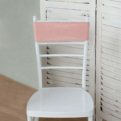 White chair with a pink seat cover against a rustic background.