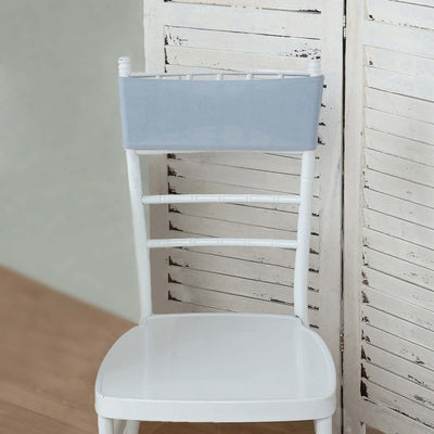 White chair with a light blue backrest cover against a wooden backdrop.