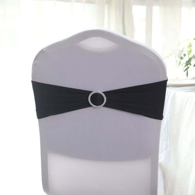 Black chair sash with rhinestone buckle on a white chair