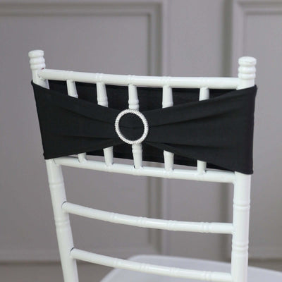 Black chair sash with rhinestone buckle for elegant decor.