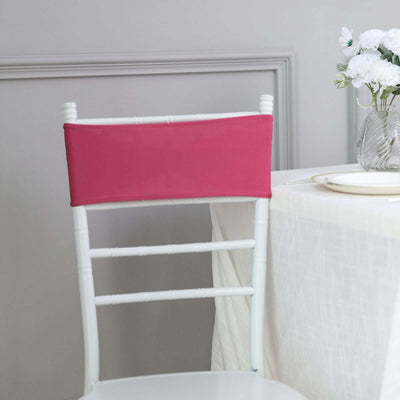 Pink chair sash on a white chiavari chair in a dining setting.