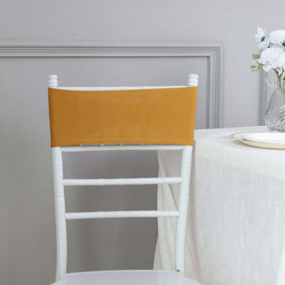 Yellow chair cover on a white chair against a neutral background.