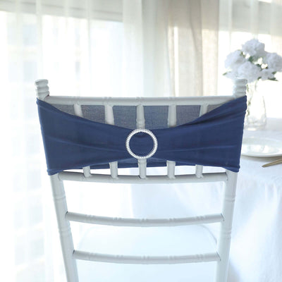 Navy chair cover with rhinestone detail on a white chiavari chair