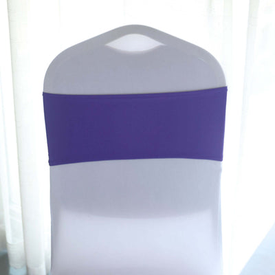 Purple chair cover on a white chair against a light background.