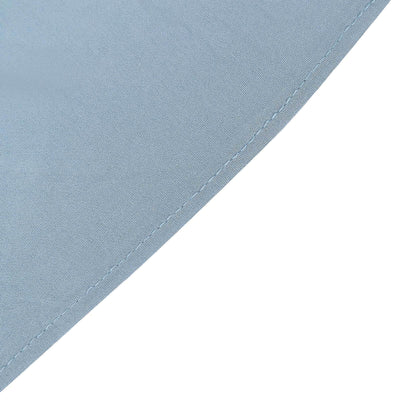 Close-up of smooth blue fabric texture and stitching detail.