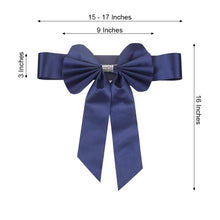A navy blue satin & faux leather bow with measurements of 15-17 inches and 16 inches