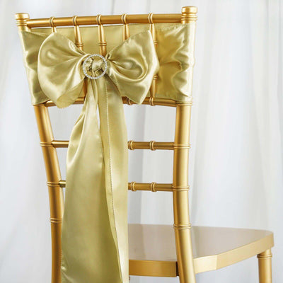 Gold chiavari chair with a satin bow and diamond-like accent.