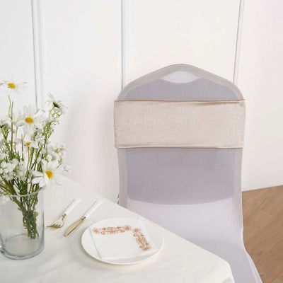 Elegant chair cover with a stylish beige backrest, set on a dining table.