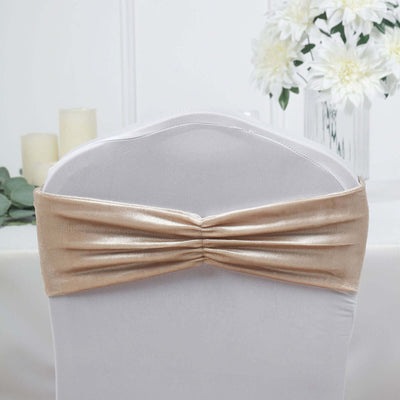 Gold chair cover sash with gathered design for elegant event decor.