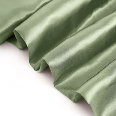 Green satin fabric with smooth texture and elegant draping.