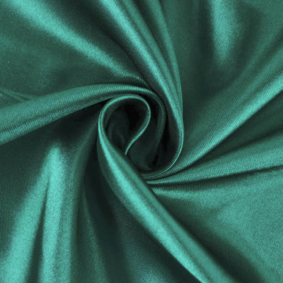 Emerald green satin fabric with a smooth, shiny texture.