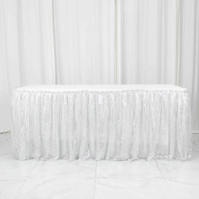 White sequin tablecloth with shimmering texture for events and parties.