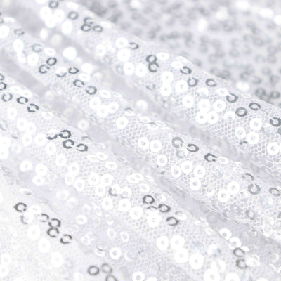 Shiny silver sequined fabric for crafting and fashion projects.