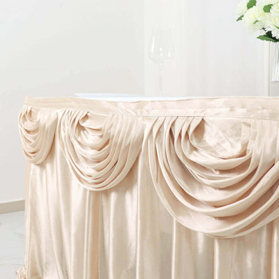 Elegant champagne-colored table skirt with draped design.