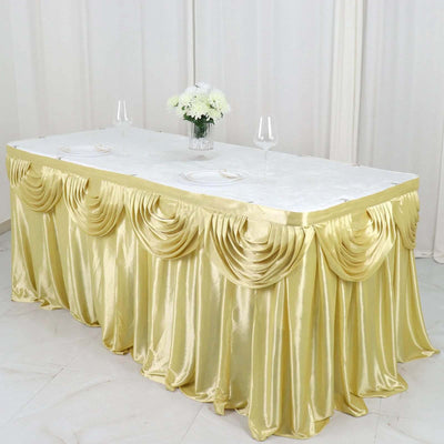 Elegant gold tablecloth with draped design for event decor.