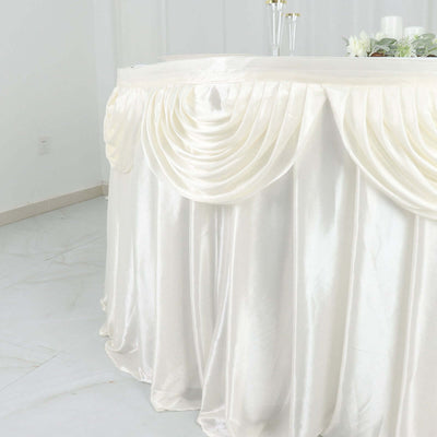 Elegant ivory table skirt with pleated design.