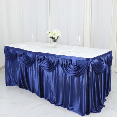 Elegant navy blue tablecloth draped with pleats, perfect for events or dining.