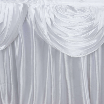 Elegant white satin table draping with soft pleats.