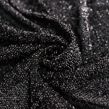 Create a Striking Decor Statement with our Black Metallic Shimmer Tinsel Table Skirt