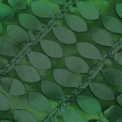 Green leaf-patterned fabric with a glossy finish.