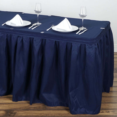Navy blue table cover with pleats and table setting for two