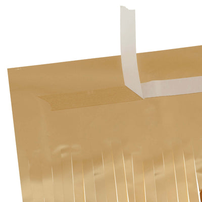 Gold foil wrapping paper with adhesive tape for easy sealing.