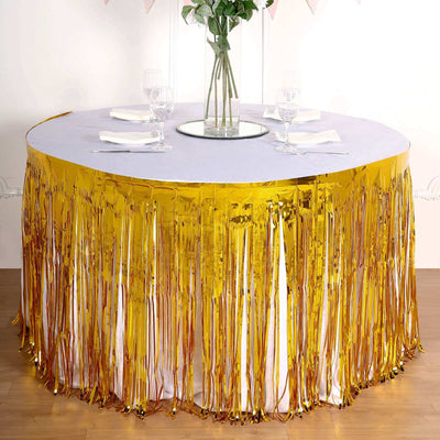 Gold fringe table skirt for festive events and celebrations.
