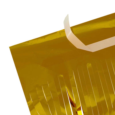 Gold metallic fringe decoration with adhesive strip for easy application.