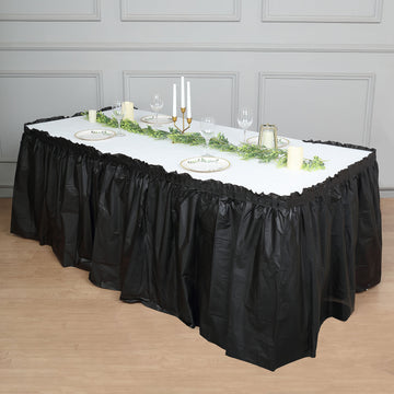 Add Elegance to Your Event with the Black Ruffled Plastic Disposable Table Skirt