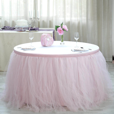 Elegant pink tulle table skirt for special events and weddings.