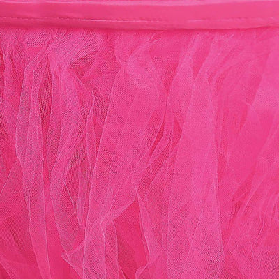 Close-up of vibrant pink tulle fabric texture.