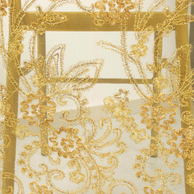 Gold embroidered floral lace fabric detail.