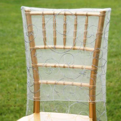Gold chiavari chair with sheer decorative cover